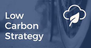 The text "Low Carbon Strategy" with a cloud and leaf icon.